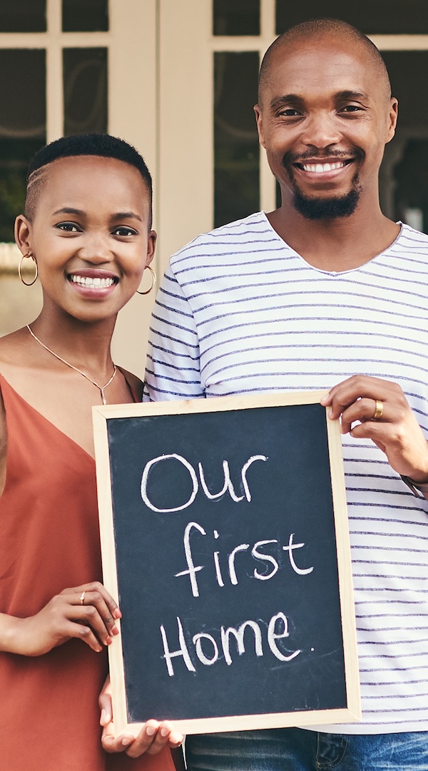 We bought our first house. Portrait of a young couple holding a chalkboard with our first home written on it. The Revolution Will Be Digital, African American Economics, Black Economics, African American Housing, Black Housing, African American Wealth, Black Wealth, African American Education, Black Education, Historical Black Colleges and Universities, HBCU, African American Health, Black Health, African American Health Care, Black Health Care, African American Jobs, Black Jobs, Misinformation, Disinformation, KOLUMN Magazine, KOLUMN, African American Politics, Black Politics, African American Vote, Black Vote, African American Home Ownership, Black Home Ownership, Diversity, Equity, Inclusion, DEI